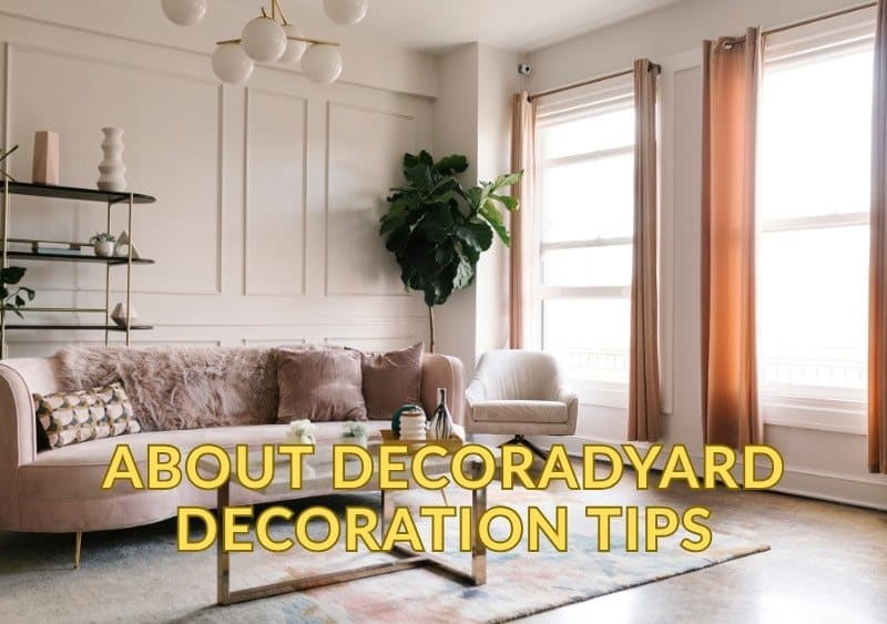 Stylish modern living room with soft pink sofa, armchair, gold accents, and large windows with flowing curtains. Includes text “About Decoradyard Decoration Tips.” Perfect example of home styling inspiration using Decoradyard decoration tips.