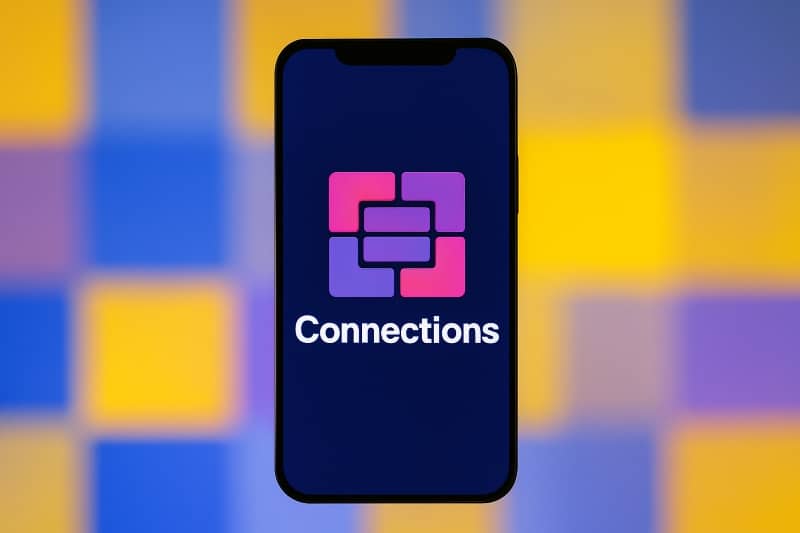Smartphone displaying the “Connections” game logo with interlocking pink and purple squares on a dark blue background, referencing the Mashable Connections Hint feature for New York Times puzzle fans.