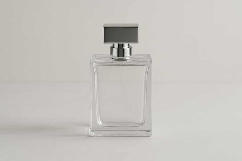 Understanding the Craft of Fragrance Dupes and Their Impact on the Industry Clear glass perfume bottle representing fragrance dupes crafted to replicate luxury scents and their impact on the fragrance industry.