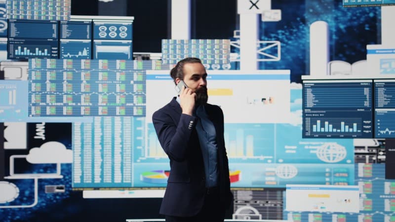 Leader analyzing Data dashboards on multiple screens to identify clear signals and make data-driven decisions without overload.