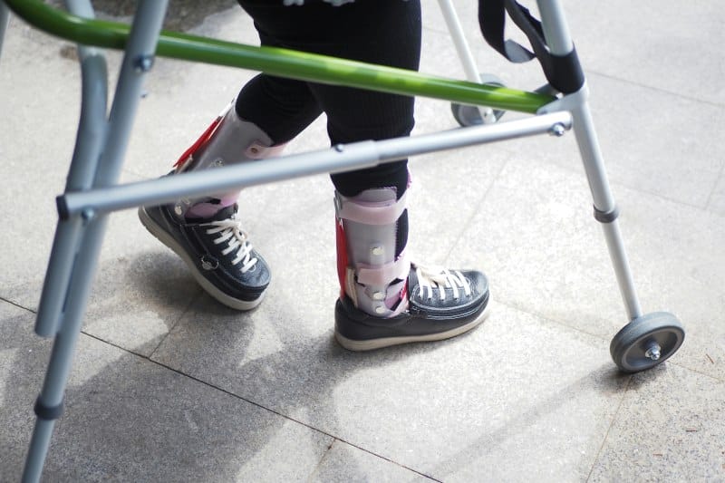 How an Injury Can Disrupt Your Work, Life, Finances, and Family Routine Injury recovery with leg brace and walker showing mobility limits affecting daily life and routine