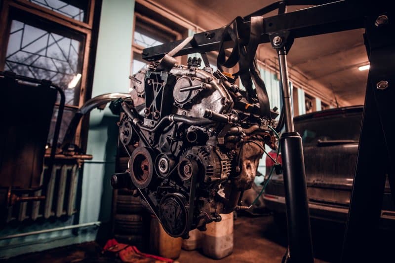 The Role of Medium-Duty Diesel Engines in Modern Transportation Medium-duty Diesel Engines lifted in a repair workshop for maintenance and transport fleet servicing.