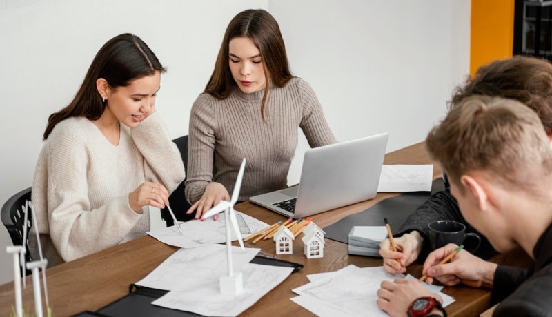 Estate Planning Trends for Modern Families: Adapting to Change Estate Planning discussion with modern family members reviewing documents and property plans at a table.