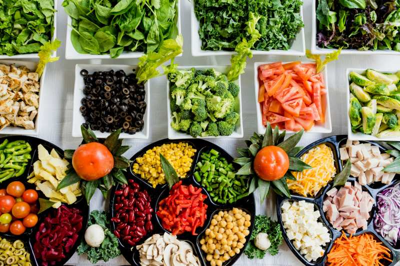 Easy Ways to Stay Consistent with Healthy Eating Healthy meal prep with vegetables, grains, avocado, and protein for staying consistent with healthy eating.